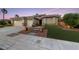 Charming single-story home with a three-car garage and manicured lawn at 616 Canyon Brook Pl, Las Vegas, NV 89145