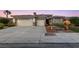 Attractive single-story home featuring a spacious three-car garage and manicured landscaping at 616 Canyon Brook Pl, Las Vegas, NV 89145