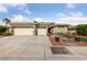 Attractive home with a three-car garage, mature landscaping, and well-kept lawn at 616 Canyon Brook Pl, Las Vegas, NV 89145