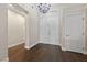 Entry foyer with hardwood floors and elegant chandelier at 616 Canyon Brook Pl, Las Vegas, NV 89145