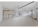 Spacious garage with storage cabinets and epoxy flooring at 616 Canyon Brook Pl, Las Vegas, NV 89145