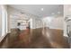 Open-concept living area showcases hardwood floors and flows into a modern kitchen at 616 Canyon Brook Pl, Las Vegas, NV 89145