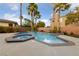 Backyard pool and spa with a tanning ledge and privacy wall at 616 Canyon Brook Pl, Las Vegas, NV 89145