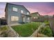 Well-manicured backyard with a covered patio and lush artificial grass at 637 Our Heritage St, Henderson, NV 89011