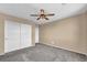 Carpeted bedroom with double door closet and a ceiling fan for added comfort at 637 Our Heritage St, Henderson, NV 89011