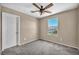 Cozy bedroom features a window with neighborhood views and a ceiling fan for comfort at 637 Our Heritage St, Henderson, NV 89011