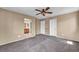 Carpeted bedroom with two closets, an ensuite bath, and a ceiling fan for added comfort at 637 Our Heritage St, Henderson, NV 89011
