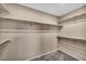 Walk-in closet with shelving, providing ample storage space in a simple design at 637 Our Heritage St, Henderson, NV 89011