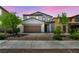 Charming two-story home with a paver driveway and well-maintained landscaping at 637 Our Heritage St, Henderson, NV 89011