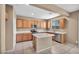 Spacious kitchen featuring ample cabinet space, an island, and stainless steel appliances at 637 Our Heritage St, Henderson, NV 89011