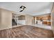 Spacious living room featuring hardwood floors, a ceiling fan, and an open concept at 637 Our Heritage St, Henderson, NV 89011