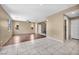 Spacious living area with tile and wood flooring, bright lighting, and an open staircase at 637 Our Heritage St, Henderson, NV 89011
