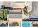 Aerial view of a home showcasing the backyard, pool, patio, and lush landscaping at 672 Peach Coral St, Las Vegas, NV 89183