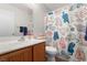 Bathroom featuring a sink, toilet, and a shower with a unique cat-themed curtain at 672 Peach Coral St, Las Vegas, NV 89183