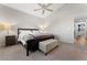 Primary bedroom featuring a bed, nightstands, and an ensuite bathroom at 672 Peach Coral St, Las Vegas, NV 89183