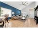 Stylish living room with vaulted ceiling, tile floors, and lots of natural light at 672 Peach Coral St, Las Vegas, NV 89183
