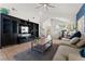 Welcoming living room with vaulted ceilings, tile floors, and an open layout to other rooms at 672 Peach Coral St, Las Vegas, NV 89183