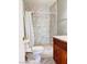 Cozy bathroom featuring a tiled shower, granite vanity and marble tile flooring at 6786 Grandola Dr, Las Vegas, NV 89103