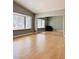 Bright bedroom with a large window, mirrored closet doors and light wood flooring at 6786 Grandola Dr, Las Vegas, NV 89103