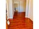Inviting entryway with wood laminate flooring, neutral walls, and white trim at 6786 Grandola Dr, Las Vegas, NV 89103