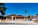 Charming single-story home with a well-maintained front yard and a two-car garage and desert landscaping at 6786 Grandola Dr, Las Vegas, NV 89103