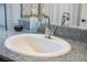 Modern bathroom featuring a white sink with granite countertop and brushed nickel faucet at 6824 Satin Silver Ct, North Las Vegas, NV 89086