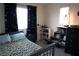 Charming bedroom with twin bed, blue accents, decorative shelves, and plenty of natural light at 6824 Satin Silver Ct, North Las Vegas, NV 89086