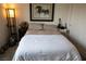 Inviting bedroom with warm lighting, guitar accents, and a comfortable bed at 6824 Satin Silver Ct, North Las Vegas, NV 89086