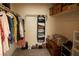Organized walk-in closet with shelving, hanging racks, and ample storage space at 6824 Satin Silver Ct, North Las Vegas, NV 89086