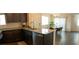 This expansive kitchen opens to a dining area and features stainless appliances and granite countertops at 6824 Satin Silver Ct, North Las Vegas, NV 89086