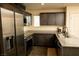 This contemporary kitchen features stainless steel appliances and plenty of cabinet space at 6824 Satin Silver Ct, North Las Vegas, NV 89086