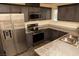 Well-equipped kitchen with stainless steel appliances, granite counters, and ample cabinet space at 6824 Satin Silver Ct, North Las Vegas, NV 89086