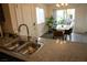This large kitchen has a combined dining space, stainless appliances, and lovely granite counters at 6824 Satin Silver Ct, North Las Vegas, NV 89086