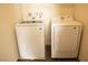 Modern laundry room with a white Samsung washer and dryer at 6824 Satin Silver Ct, North Las Vegas, NV 89086