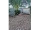 Backyard with rock landscaping and block wall, with some vegetation at 7104 Carrondale Way, Las Vegas, NV 89128