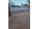 Backyard with rock landscaping and block wall with some vegetation at 7104 Carrondale Way, Las Vegas, NV 89128
