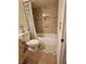 Bathroom showcasing bathtub, shower, toilet and sink with decorative cabinet at 7104 Carrondale Way, Las Vegas, NV 89128