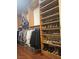 Organized walk-in closet featuring shelving, hanging rods, and shoe racks for ample storage at 7104 Carrondale Way, Las Vegas, NV 89128