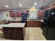 Well-appointed kitchen showcasing dark cabinets, modern appliances, and ample counter space for cooking at 7104 Carrondale Way, Las Vegas, NV 89128