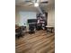 Well-lit office featuring a ceiling fan, built-in shelving, and hardwood floors at 7104 Carrondale Way, Las Vegas, NV 89128