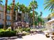 Outdoor amenities with rock waterfall feature, lush landscaping, and seating areas for community gatherings at 7147 S Durango Dr # 211, Las Vegas, NV 89113