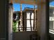 Balcony offers views of a building exterior framed by palm trees at 7147 S Durango Dr # 211, Las Vegas, NV 89113
