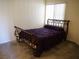 Bright bedroom with carpet, queen bed, and a window for natural light at 7147 S Durango Dr # 211, Las Vegas, NV 89113