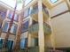 Multi-story complex displays numerous windows and balconies, surrounded by tall palm trees and ground-level foliage at 7147 S Durango Dr # 211, Las Vegas, NV 89113