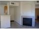 Living room featuring a fireplace and neutral color palette, with the entry door visible at 7147 S Durango Dr # 211, Las Vegas, NV 89113