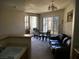 Inviting living space featuring dining area, balcony access, and comfortable seating, perfect for relaxation at 7147 S Durango Dr # 211, Las Vegas, NV 89113