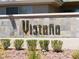 Community signage with stone accents and landscaping, showcasing the neighborhood's entrance at 7147 S Durango Dr # 211, Las Vegas, NV 89113
