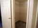 Walk-in closet with shelving, carpet and a door, offering ample storage space at 7147 S Durango Dr # 211, Las Vegas, NV 89113