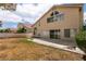 An ample backyard features a patio, grass, and low-maintenance landscaping at 7620 Tortola Bay Ln, Las Vegas, NV 89128