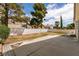 Backyard includes a concrete patio and trees at 7620 Tortola Bay Ln, Las Vegas, NV 89128